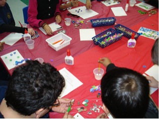 Figure 3. Participants working on street art inspired mosaics during “Tyndale Ti(l)es” lesson